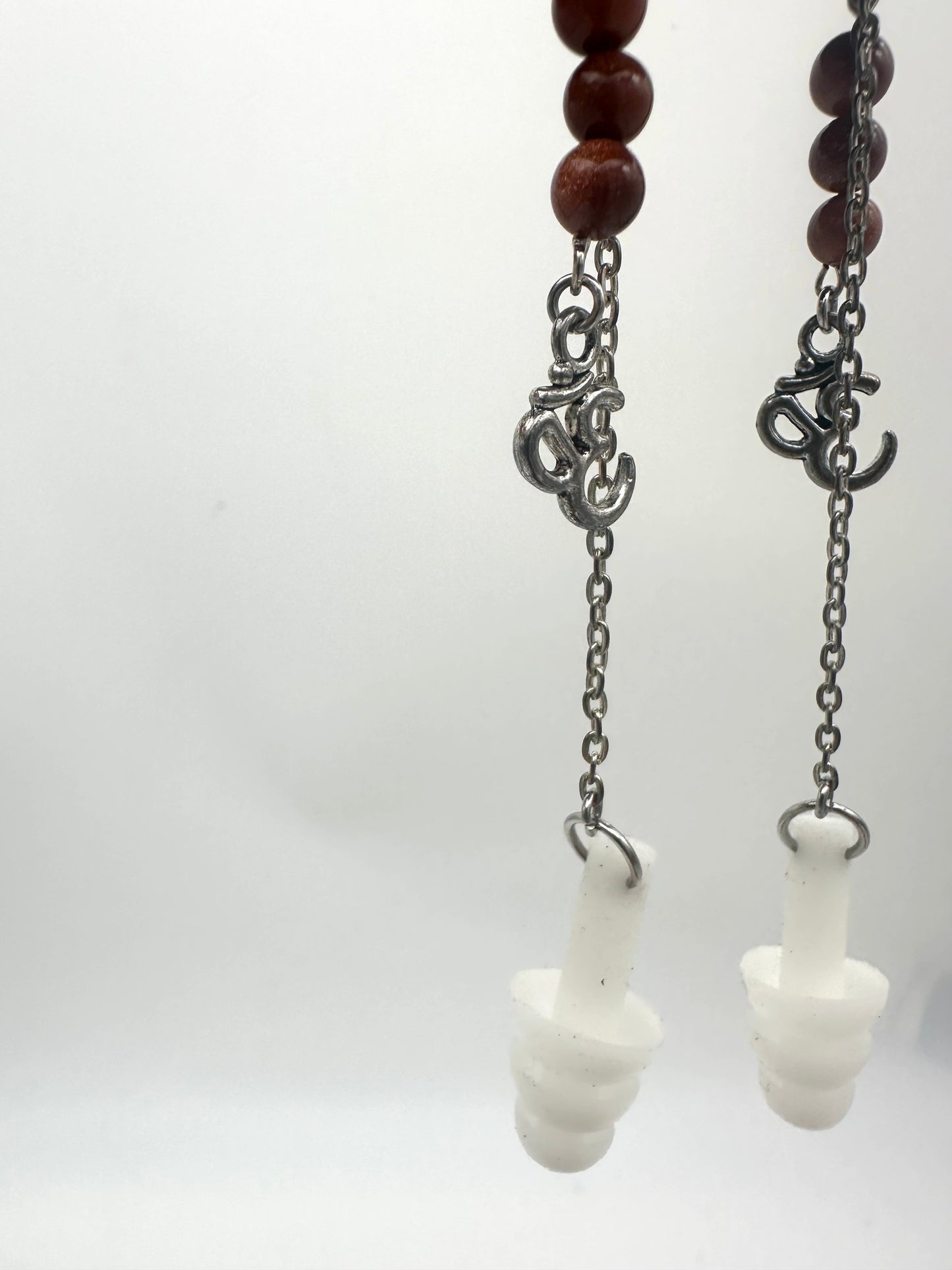 Peace & Protection – Earplug Earrings with Sunstone & Ohm Charm