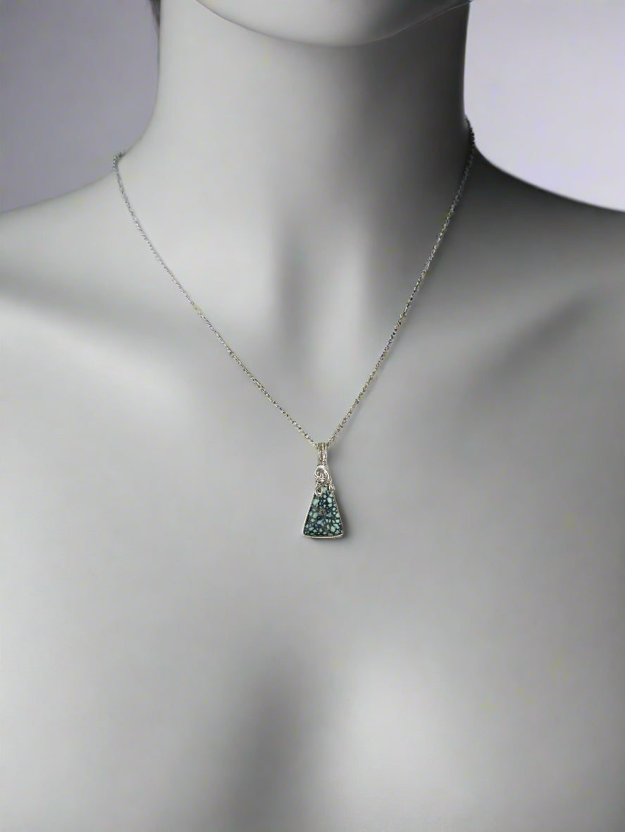 Pendant styled on mannequin showing 16” length