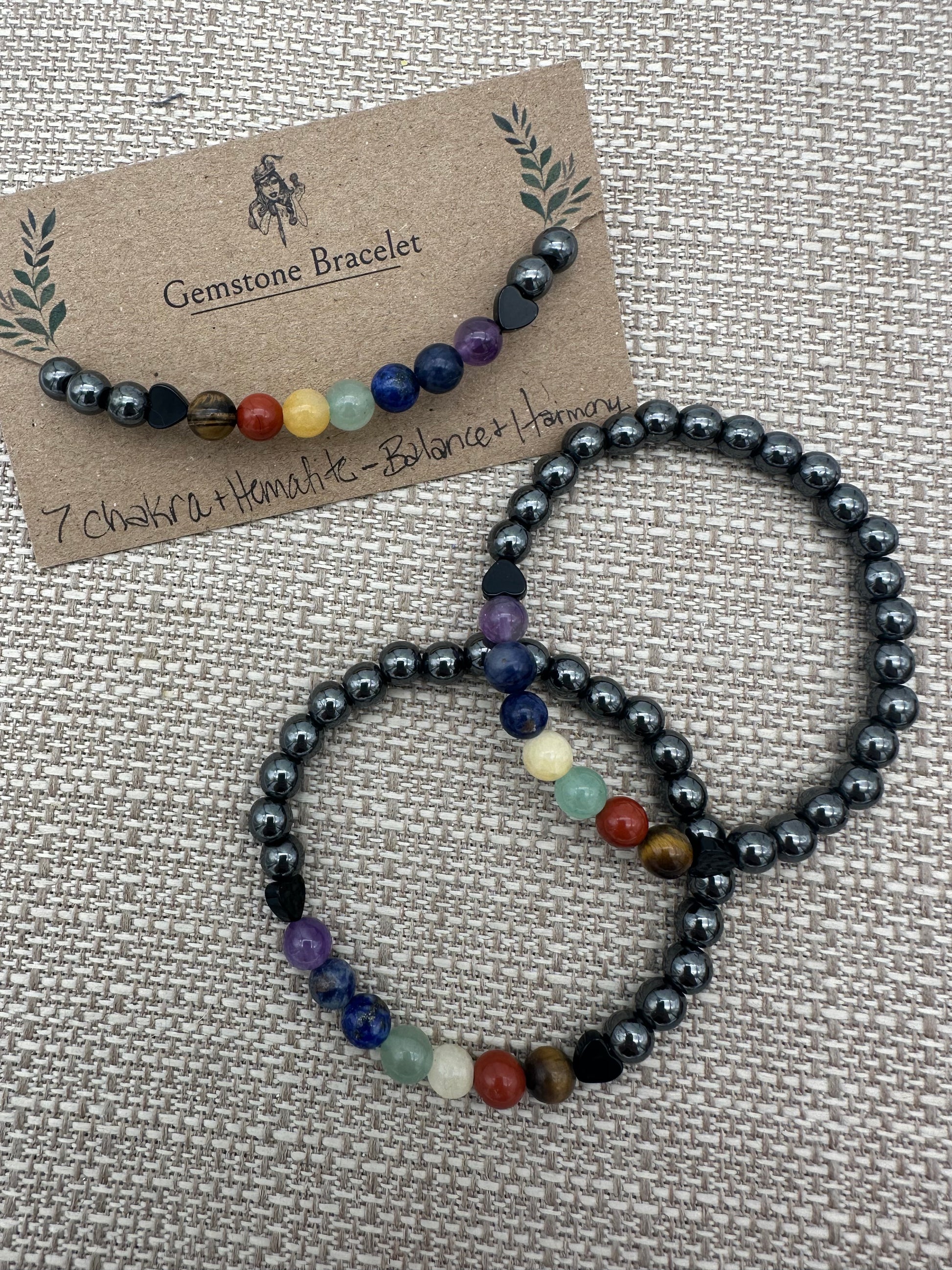 Gemstone bracelet with multicolored beads on a textured surface