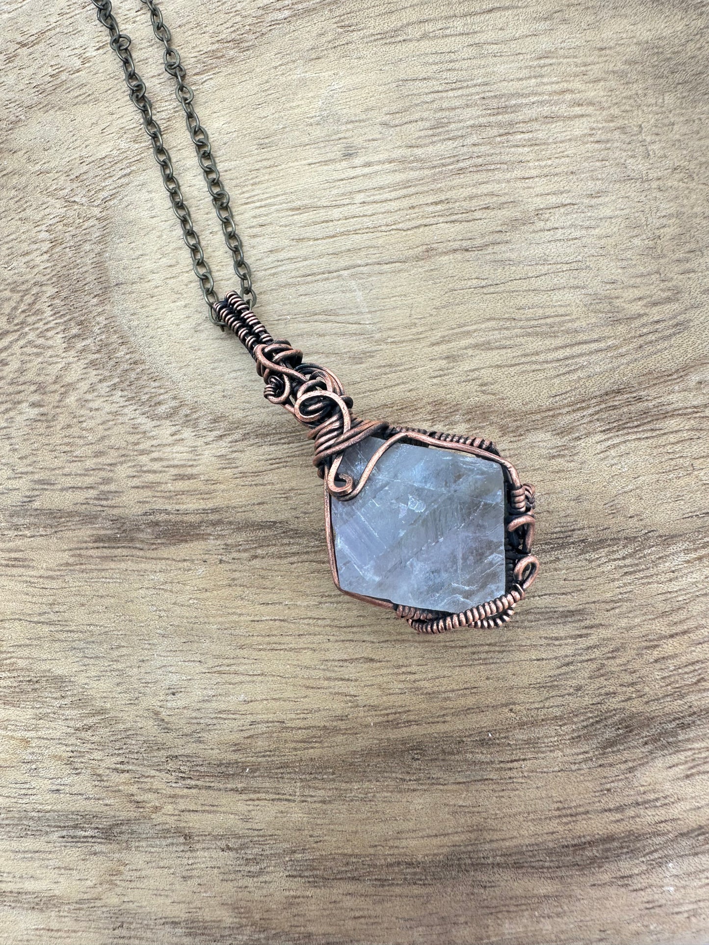 Fluorite octahedron wrapped pendant side view