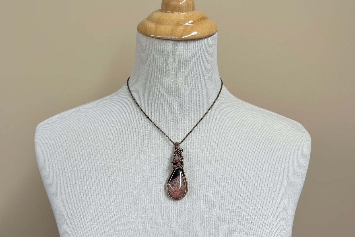 Closeup of fossilized palm root texture with copper wire wrap details