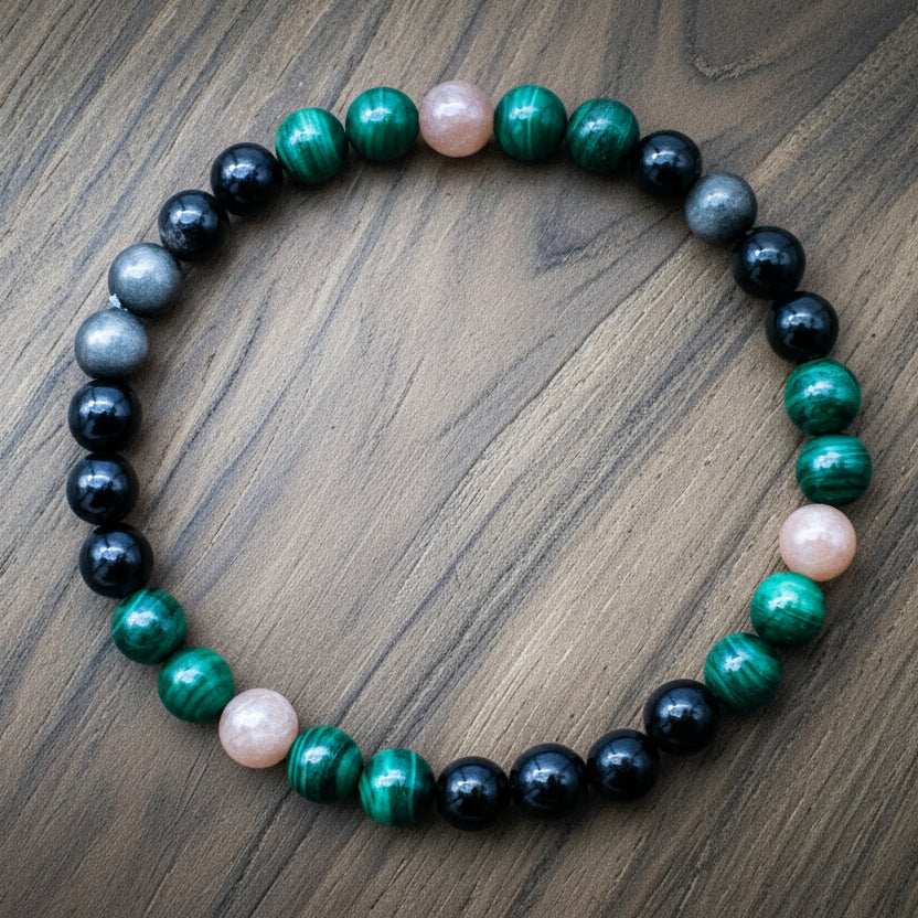 Handmade malachite, onyx, and peach moonstone gemstone bracelet on elastic cord